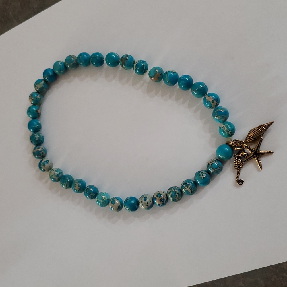 Turquoise like stone bead sea life necklace